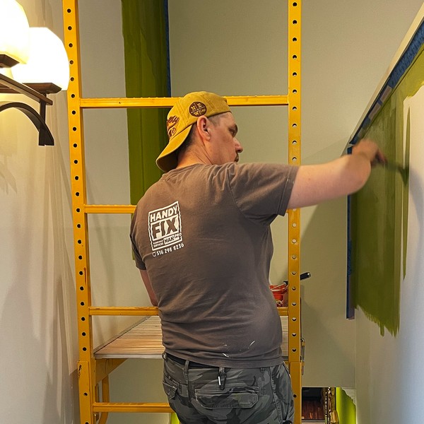 Ivan painting an accent wall