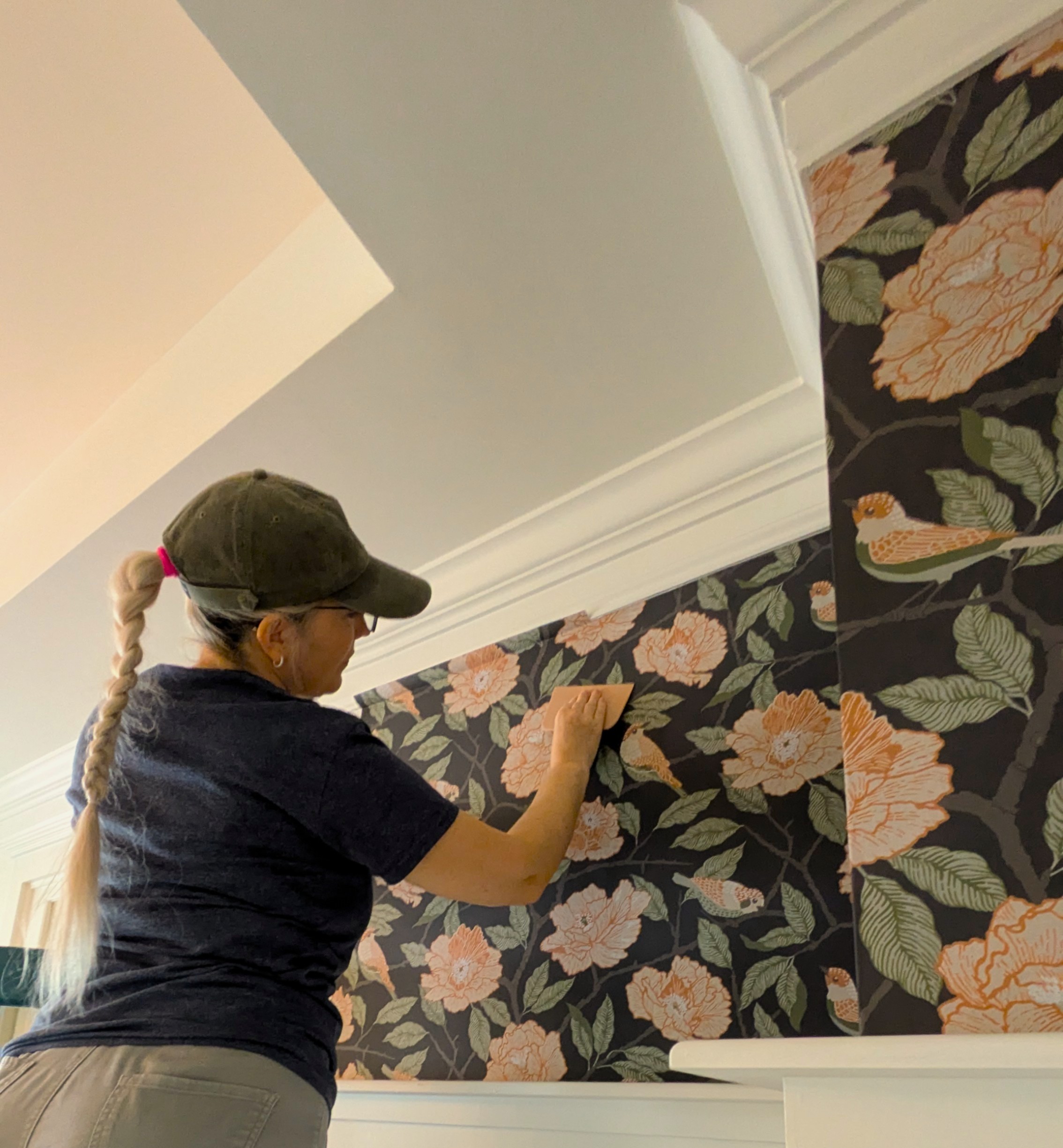 Natalia prepping plumbing behind an accent wall